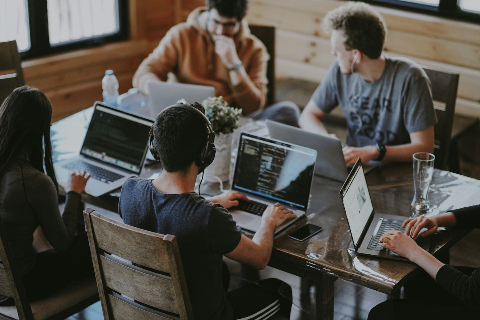 Developers collaborating on software with AI-assisted workflows