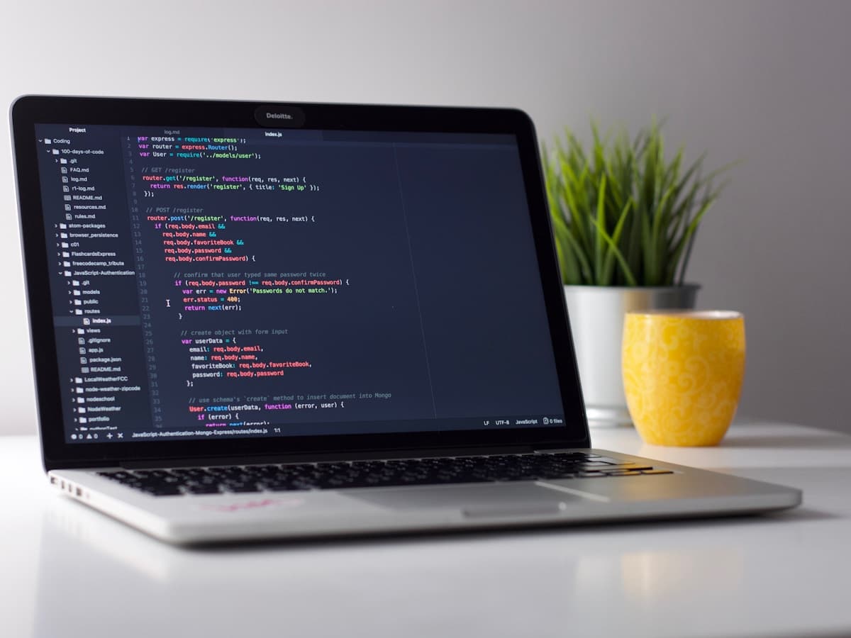 Developer working at a computer with code on screen