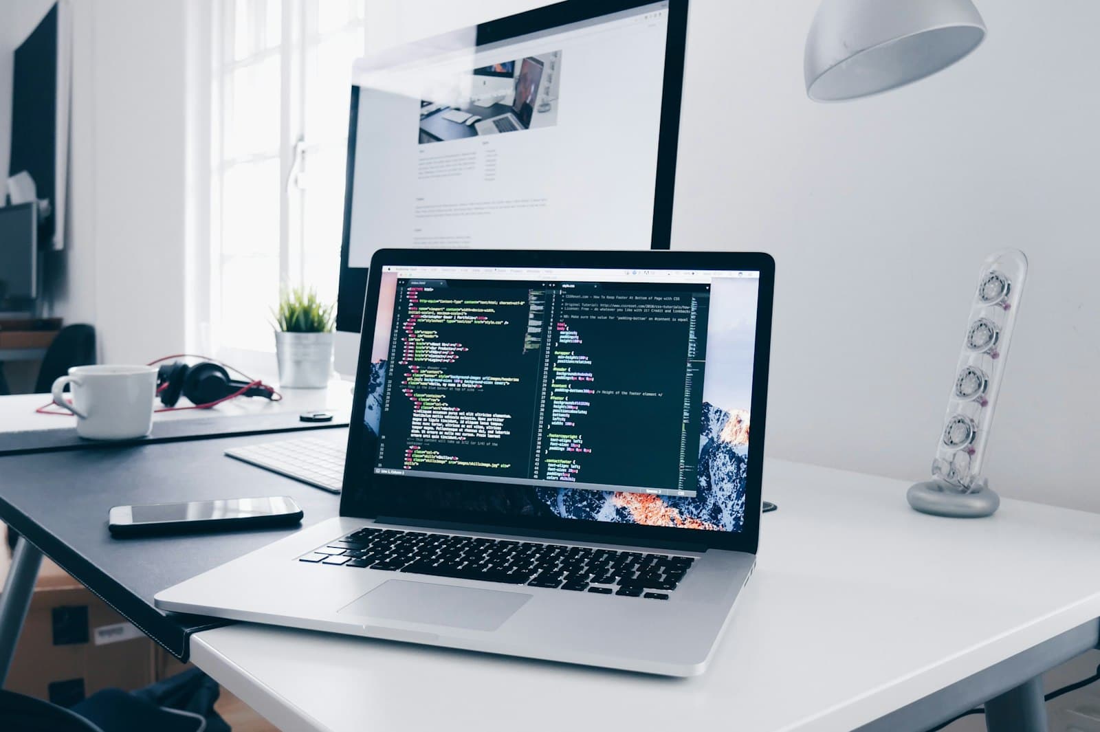 Developer building a web application on a laptop